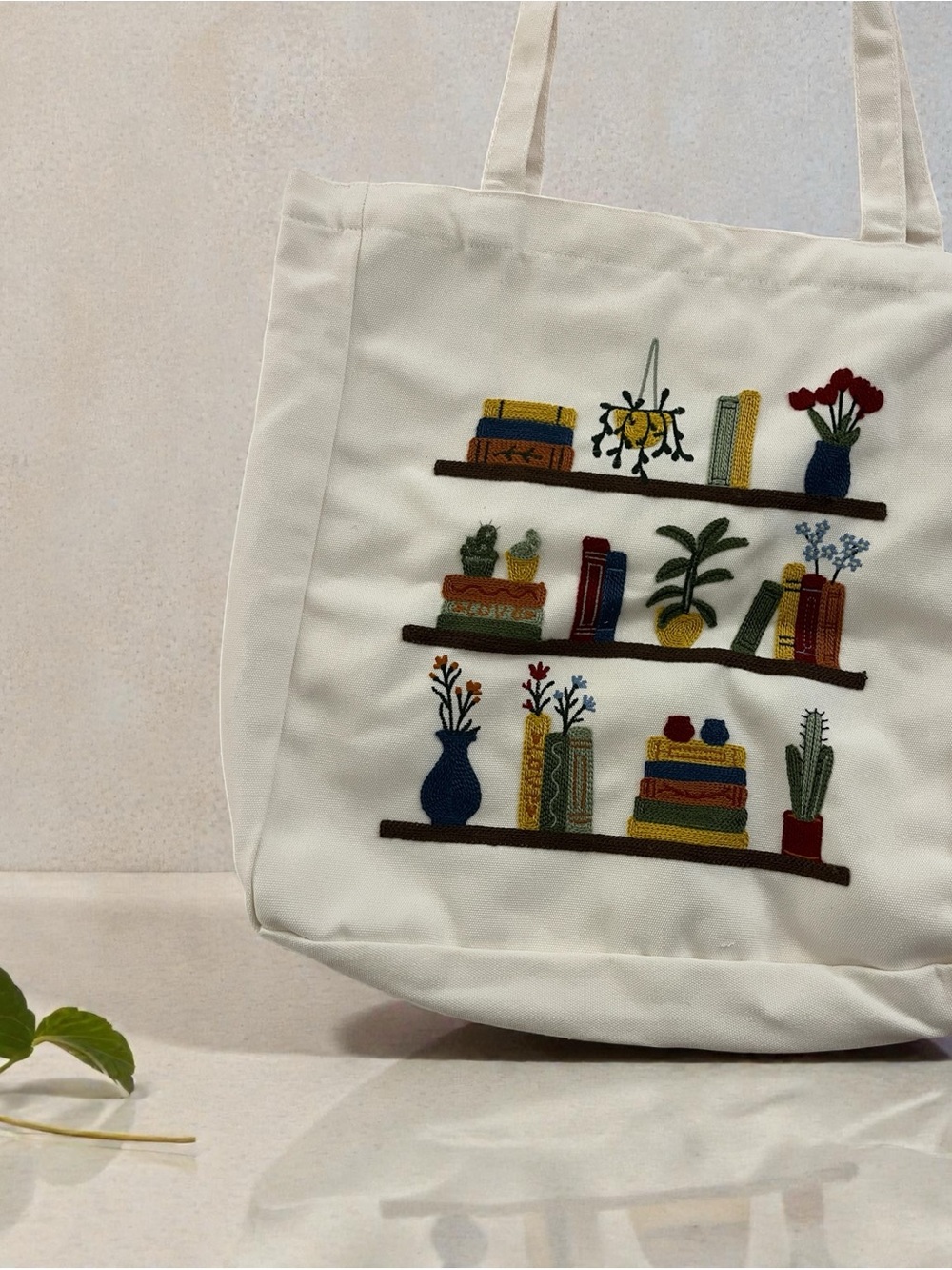 Tote Bag with Colorful Embroidered Bookshelves with plants. New